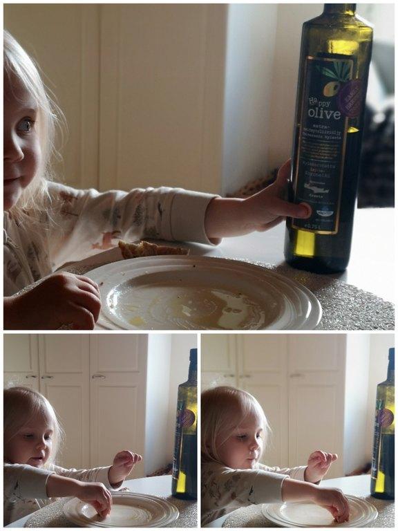 Tyttö dippaa oliiviöljyä